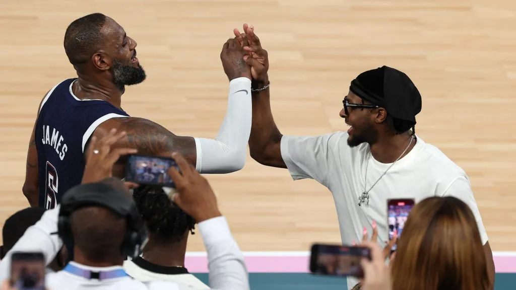 LeBron James #6 of Team United States high fives his son and NBA player Bronny James after Team United States’ victory against Team France during the Men’s Gold Medal game between Team France and Team United States. (Photo by Jamie Squire/Getty Images)