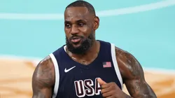 LeBron James #6 of Team United States high fives former NBA player Carmelo Anthony after Team United States's victory against Team France during the Men's Gold Medal game between Team France and Team United States on day fifteen of the Olympic Games Paris 2024.