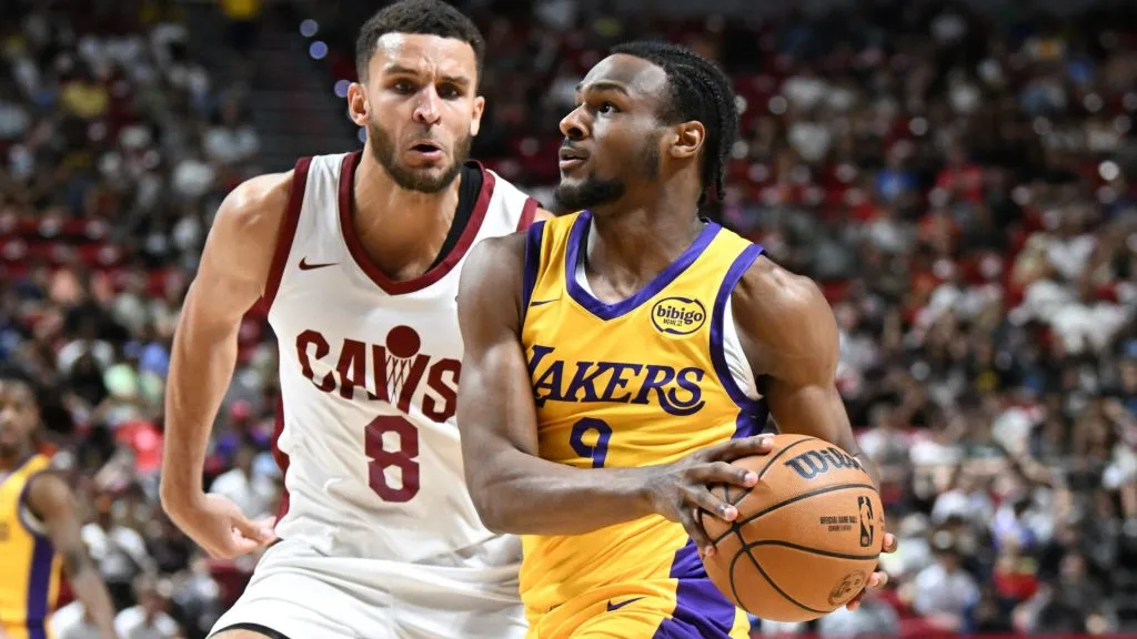 Bronny James Jr. #9 of the Los Angeles Lakers drives past Pete Nance #8 of the Cleveland Cavaliers during a 2024 NBA Summer League game at the Thomas &amp; Mack Center. (Photo by Candice Ward/Getty Images)