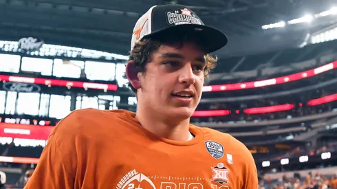 Texas Longhorns quarterback Arch Manning walks off the field after the Big 12 Conference Championship NCAA, College League, USA college football game against the Oklahoma State Cowboys at AT&T Stadium in Arlington, TX