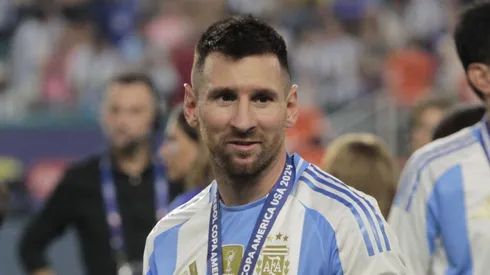 Lionel Messi celebrating Argentina's 2024 Copa America after defeating Colombia 1-0 at Hard Rock Stadium in Miami, Florida.