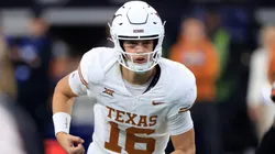 Quarterback Arch Manning #16 of the Texas Longhorns runs behind the line against the Oklahoma State Cowboys in the second half of the Big 12 Championship at AT&T Stadium on December 2, 2023 in Arlington, Texas.