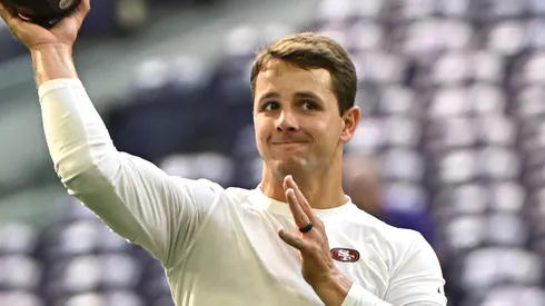 Quarterback Brock Purdy #13 of the San Francisco 49ers warms up prior to a game against the Minnesota Vikings at U.S. Bank Stadium on September 15, 2024 in Minneapolis, Minnesota.