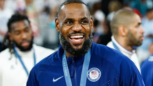 Gold medalist LeBron James of the United States celebrates during the men's basketball medal ceremony after the gold medal game between France and the United States at Bercy Arena during the Paris 2024 Olympic Games.