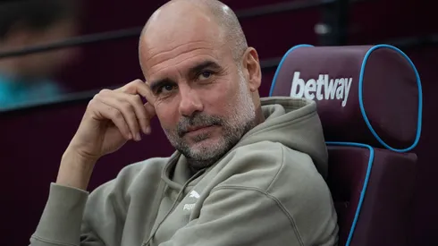 Pep Guardiola watching Premier League match.