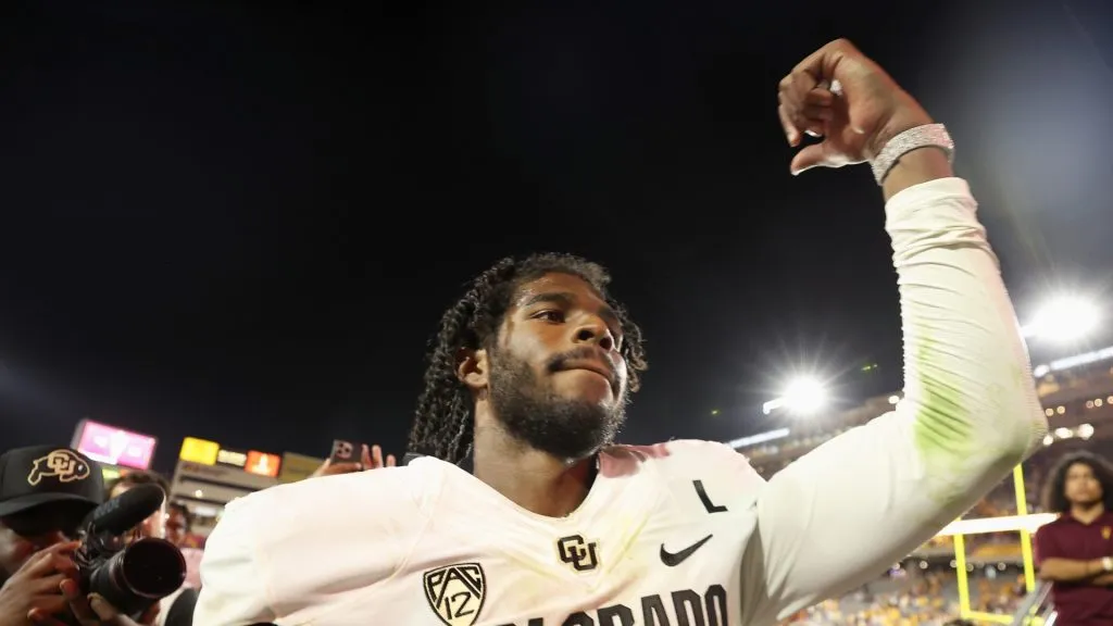 Quarterback Shedeur Sanders #2 of the Colorado Buffaloes celebrates as he walks off the field following the NCAAF game against the Arizona State Sun Devils at Mountain America Stadium on October 07, 2023 in Tempe, Arizona. The Buffaloes defeated the Sun Devils 27-24.