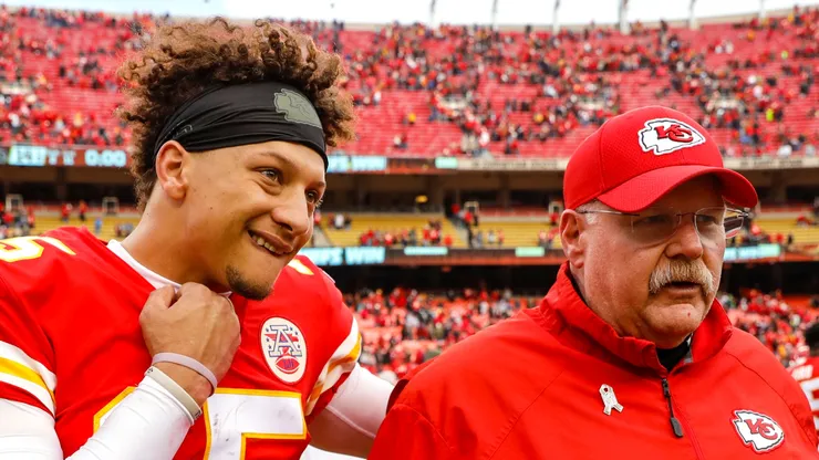 Patrick Mahomes walking off the field with Andy Reid.