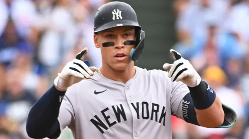 Aaron Judge #99 of the New York Yankees reacts after an RBI double during the third inning of a game against the Chicago Cubs at Wrigley Field.