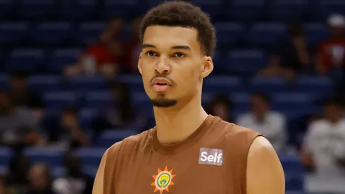 Victor Wembanyama #1 of the San Antonio Spurs participates in warmups