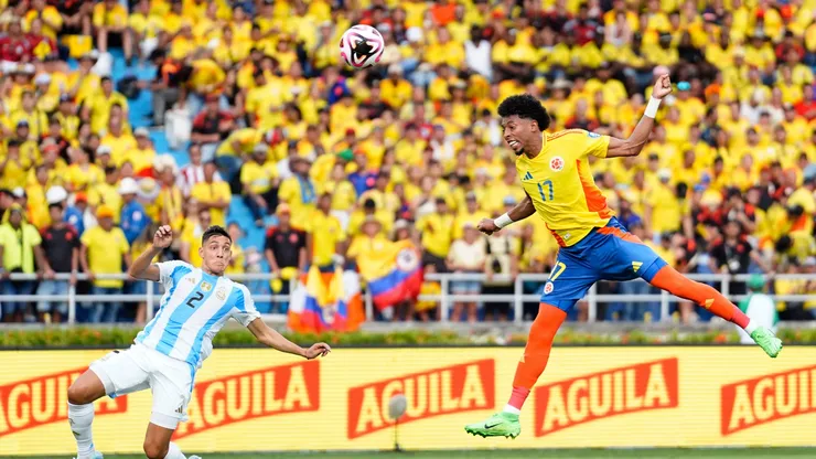 Johan Mojica of Colombia heads the ball against Nahuel Molina of Argentina during the South American FIFA World Cup 2026 Qualifier match