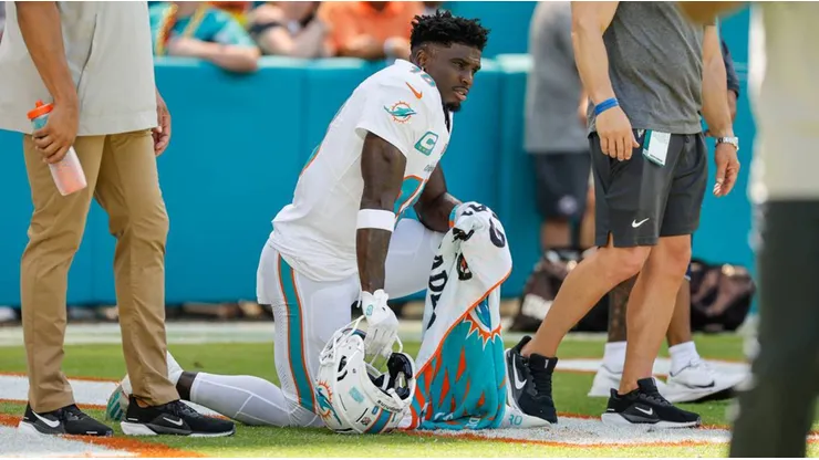 Tyreek Hill takes a knee.