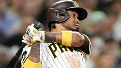 Luis Arraez #4 of the San Diego Padres hits a double in the eighth inning against the Pittsburgh Pirates.