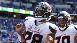 Joe Mixon #28 of the Houston Texans celebrates after scoring a touchdown in the fourth quarter of the game against the Indianapolis Colts at Lucas Oil Stadium on September 08, 2024 in Indianapolis, Indiana.