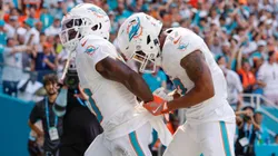 Miami Dolphins wide receiver Tyreek Hill (10) holds his hands behind his back as if he is handcuffed as wide receiver Jaylen Waddle (17) unlocks them after Waddle scores in the second half against the Jacksonville Jaguars at Hard Rock Stadium in Miami Gardens, Florida, on Sunday, Sept. 8, 2024.