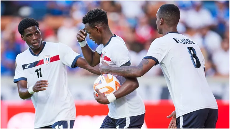 Maykel Reyes of Cuba celebrates with teammates