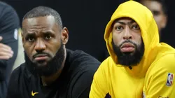 LeBron James (L) #23 and Anthony Davis #3 of the Los Angeles Lakers look on from the bench
