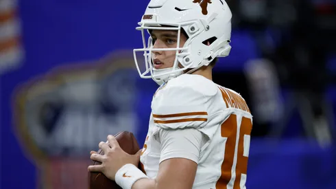 Arch Manning #16 of the Texas Longhorns warms up prior to playing against the Washington Huskies during the CFP Semifinal Allstate Sugar Bowl at Caesars Superdome on January 01, 2024 in New Orleans, Louisiana.