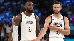 LeBron James #6 of Team United States watches as Stephen Curry #4 of Team United States celebrates towards his bench