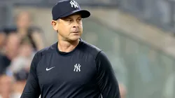 Aaron Boone #17 of the New York Yankees walks back to the dugout after being ejected in the top of the seventh inning during the game against the Atlanta Braves.