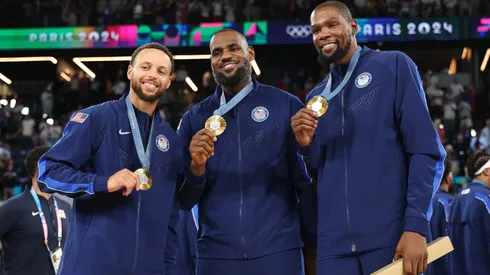 Stephen Curry, LeBron James and Kevin Durant celebrate the gold medal won with Team USA in the Paris 2024 Olympic Games.
