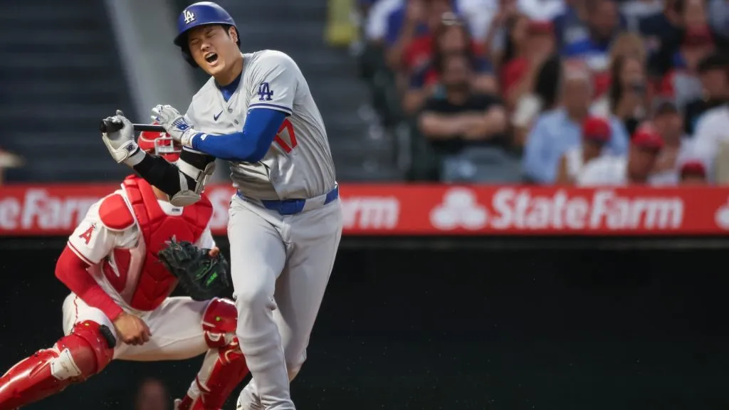 Shohei Ohtani #17 of the Los Angeles Dodgers reacts after being hit by the ball while at bat in the third inning against the Los Angeles Angels at Angel Stadium of Anaheim. (Photo by Meg Oliphant/Getty Images)