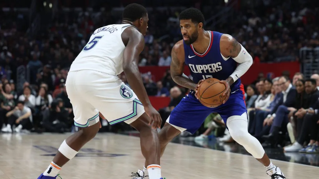 Paul George #13 of the LA Clippers is guarded by Anthony Edwards #5 of the Minnesota Timberwolves during a 118-100 Timberwolves win. Harry How/Getty Images