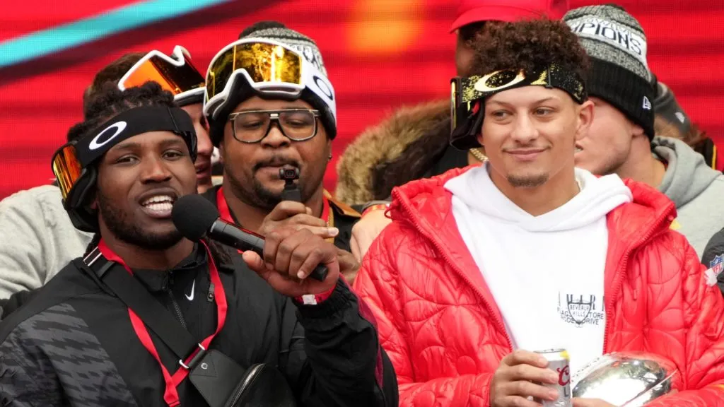 Nick Bolton #32 of the Kansas City Chiefs and Patrick Mahomes #15 of the Kansas City Chiefs celebrate on stage during the Kansas City Chiefs Super Bowl LVII victory parade on February 15, 2023 in Kansas City, Missouri.