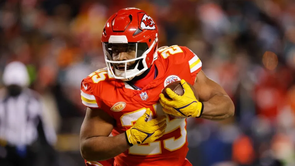 Clyde Edwards-Helaire #25 of the Kansas City Chiefs runs with the ball during the second half against the Miami Dolphins in the AFC Wild Card Playoffs at GEHA Field at Arrowhead Stadium on January 13, 2024 in Kansas City, Missouri.