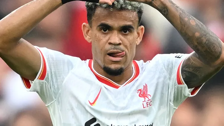 Luis Diaz of Liverpool celebrates scoring his team's first goal during the Premier League match between Manchester United FC and Liverpool FC at Old Trafford on September 01, 2024 in Manchester, England.