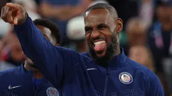 Gold medalist LeBron James celebrates on the podium during the Men's basketball medal ceremony on day fifteen of the Olympic Games Paris 2024 at Bercy Arena on August 10, 2024 in Paris, France.