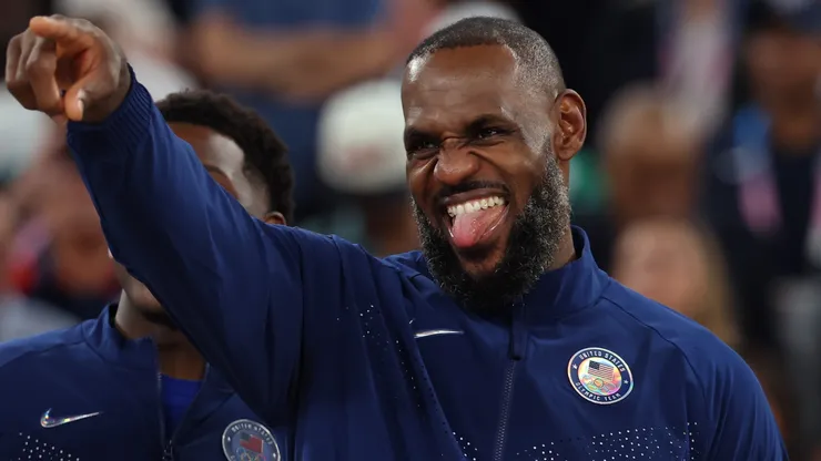 Gold medalist LeBron James celebrates on the podium during the Men's basketball medal ceremony on day fifteen of the Olympic Games Paris 2024 at Bercy Arena on August 10, 2024 in Paris, France.