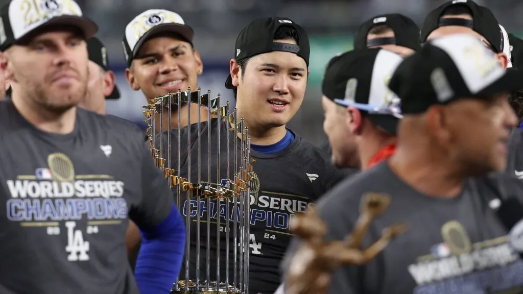 Shohei Ohtani celebrating with the trophy