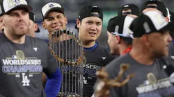 Shohei Ohtani #17 of the Los Angeles Dodgers celebrates with the trophy after the Dodgers defeated the New York Yankees 7-6 in game 5 to win the 2024 World Series at Yankee Stadium on October 30, 2024 in the Bronx borough of New York City.