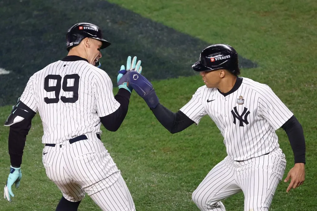 Aaron Judge #99 of the New York Yankees is congratulated by Juan Soto #22