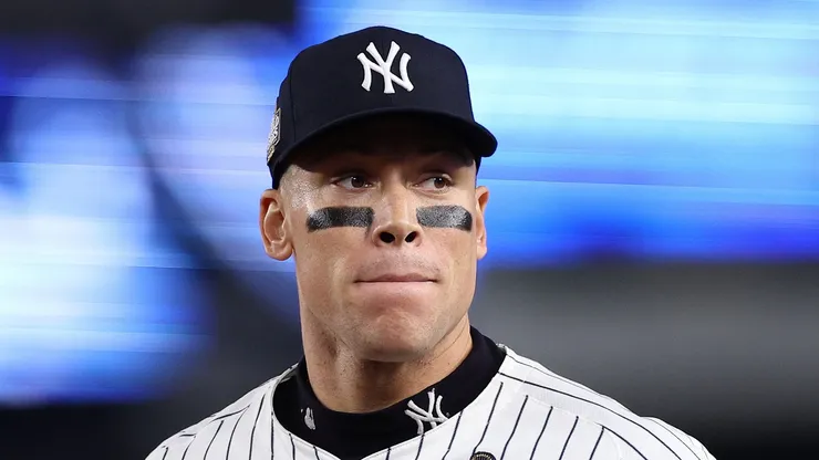 Aaron Judge #99 of the New York Yankees jogs in at the end of the inning after catching a ball hit off the bat of Freddie Freeman #5 of the Los Angeles Dodgers at the wall during the fourth inning of Game Five of the 2024 World Series at Yankee Stadium on October 30, 2024 in the Bronx borough of New York City.