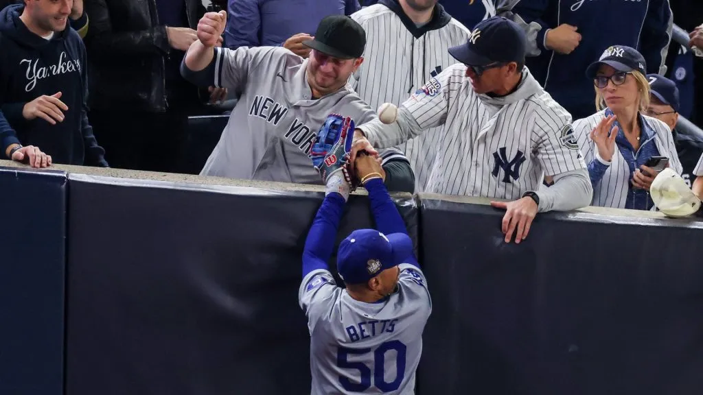 Mookie Betts and Yankees fans trying to catch the ball