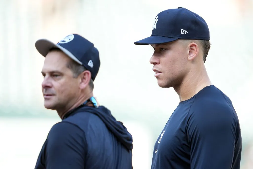 BALTIMORE, MARYLAND – APRIL 29:  Manager Aaron Boone #1 and Aaron Judge #99 of the New York Yankees talk during batting practice prior to a game against the Baltimore Orioles at Oriole Park at Camden Yards on April 29, 2024 in Baltimore, Maryland. (Photo by Mitchell Layton/Getty Images)