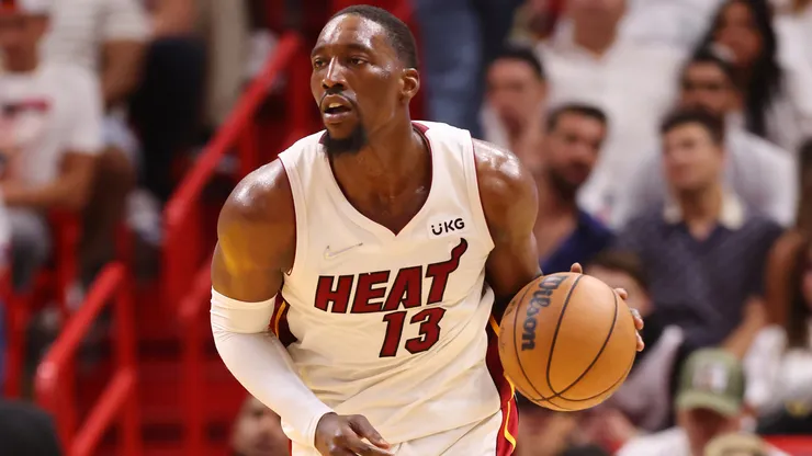 Bam Adebayo #13 of the Miami Heat dribbles up the court against the Boston Celtics