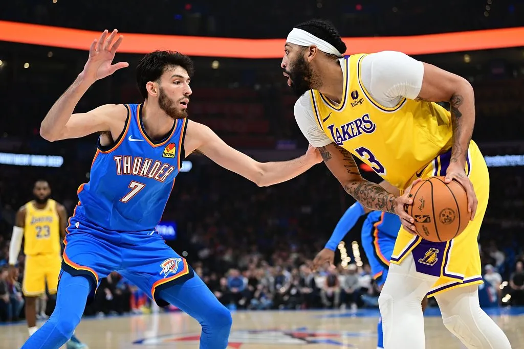 Anthony Davis #3 of the Los Angeles Lakers handles the ball while being defended by Chet Holmgren #7 of the Oklahoma City Thunder. Joshua Gateley/Getty Images