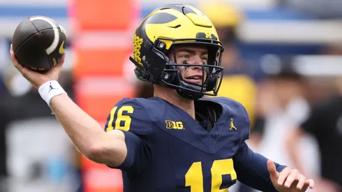 Davis Warren #16 of the Michigan Wolverines throws a pass during the second quarter against the Texas Longhorns at Michigan Stadium on September 07, 2024 in Ann Arbor, Michigan.