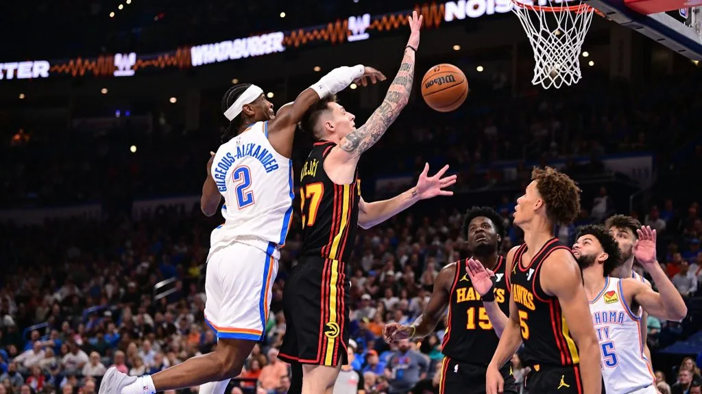 Shai Gilgeous-Alexander #2 of the Oklahoma City Thunder blocks the attempted shot of Vit Krejci #27 of the Atlanta Hawks during the second half at Paycom Center on October 27, 2024 in Oklahoma City, Oklahoma.