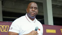 Earvin 'Magic' Johnson, a new owner of the Washington Commanders, greets fans at a pep rally after a press conference introducing the team's new ownership at on July 21, 2023 in Landover, Maryland. NFL teams owners have unanimously approved a $6.05 billion sale of the Commanders from Dan Snyder to a group led by Josh Harris.