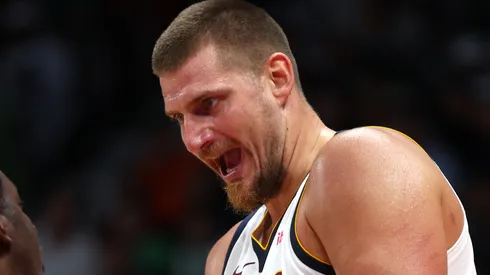 Nikola Jokic of Denver Nuggets speaks to the referee during the NBA match between Boston Celtics and Denver Nuggets at Etihad Arena on October 06, 2024 in Abu Dhabi, United Arab Emirates.