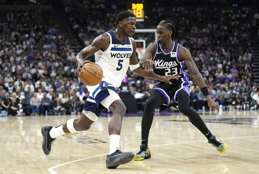 SACRAMENTO, CALIFORNIA – OCTOBER 24: Anthony Edwards #5 of the Minnesota Timberwolves dribbles the ball while defended by Keon Ellis #23 of the Sacramento Kings during the second quarter at Golden 1 Center on October 24, 2024 in Sacramento, California. (Photo by Thearon W. Henderson/Getty Images)
