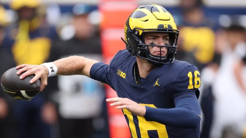 Davis Warren #16 of the Michigan Wolverines throws a pass during the second quarter against the Texas Longhorns at Michigan Stadium on September 07, 2024 in Ann Arbor, Michigan.