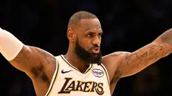 LeBron James #23 of the Los Angeles Lakers asks for the crowd to quiet down as Anthony Davis #3 shots free throws against the Sacramento Kings in the fourth quarter at Crypto.com Arena on October 26, 2024 in Los Angeles, California.