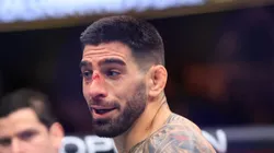 Ilia Topuria reacts to knocking out Alexander Volkanovski of Australia in their featherweight title fight during UFC 298 at Honda Center on February 17, 2024 in Anaheim, California.