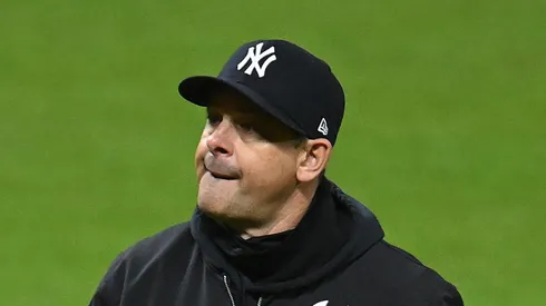Manager Aaron Boone #17 of the New York Yankees walks to the dugout during the seventh inning against the Cleveland Guardians during Game Three of the American League Championship Series at Progressive Field on October 17, 2024 in Cleveland, Ohio.