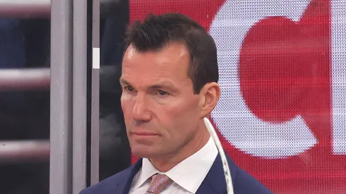 Head coach Luke Richardson of the Chicago Blackhawks looks on against the Minnesota Wild during the second period of a preseason game at the United Center on October 04, 2024 in Chicago, Illinois.