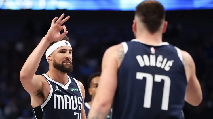 Klay Thompson #31 of the Dallas Mavericks congratulates Luka Doncic #77 on his three-point basket against the San Antonio Spurs.